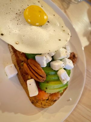 Avocado on gluten free toast with tomatoes, ‘feta’, and vegan egg! at Mukka Coffee in Mallorca