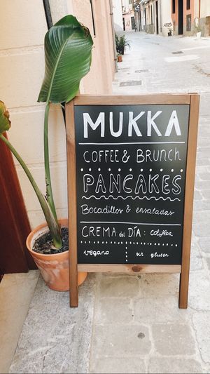 outside at Mukka Coffee in Mallorca