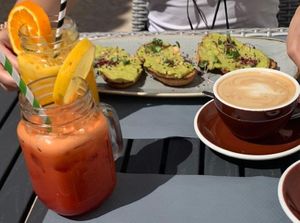 Avocado toast with coffee with milk, beetroot juice and fresh orange juice. at Abigail's Cafe in Lagos