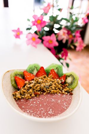 Vegan and Gluten Free tropical Acaí Smoothie Bowl with homemade granola & fresh fruit at Abigail's Cafe in Lagos