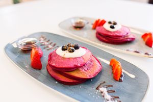 Our Red Velvet Beetroot, Chocolate pancakes served with a side of Canadian Maple Syrup at Abigail's Cafe in Lagos