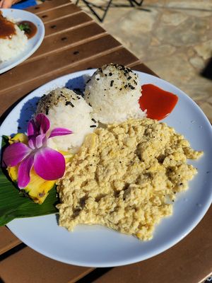 Vegan tofu scrabble without onions and peppers. Chili lime Sriracha on the side at Barefoot Beach Cafe in Honolulu