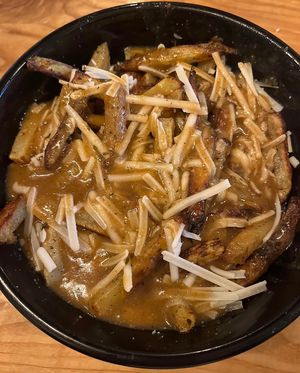 Poutine w/ Oven-Baked Fries & Mushroom Gravyy  at Copper Branch - Strandherd in Nepean