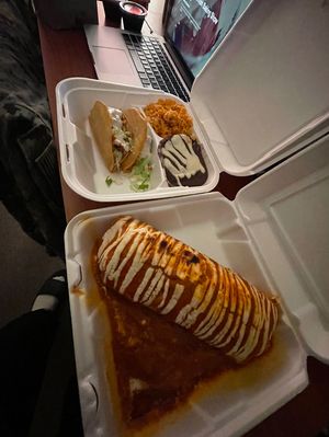 Two tacos with seasoned rice, spicy black beans, and a foot long burrito. 🌯 🍚 🌮  at Reyna's in Lemoore