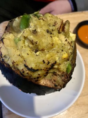 the curry was a mushy potato-ish dish, including veggies, tofu, mock chicken, corn and probably more.. served in an actual coconut!  at Sapa Classic Vegan in Sapa