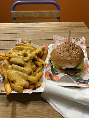 Delicious cheesey chips made with a cashew sauce and a very tasty classic burger the burger sauce was delicious.   at Herbivorous in Sheffield