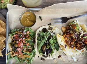 Yummy veggie tacos with guacamole and house chips (they can make without parm if you ask) 💚  at Fire It Up in Naperville