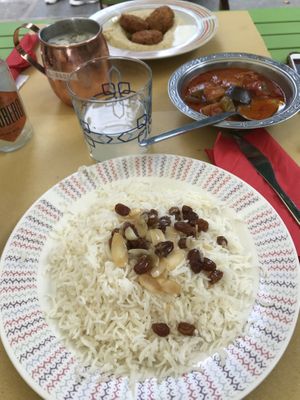 Basmati rice w/ almonds and raisins + veggies ragout  at Kirkuk Kaffe in Turin