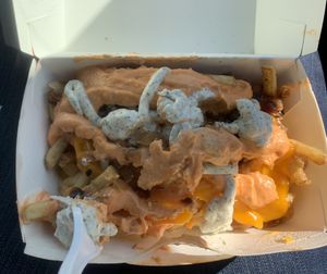 Iconic fries topped with vegan ranch  at Plant Power Fast Food in Long Beach