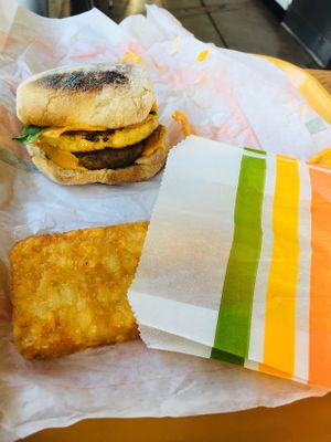 Breakfast sausage, egg & cheese sandwich with a hash brown at Plant Power Fast Food in Long Beach