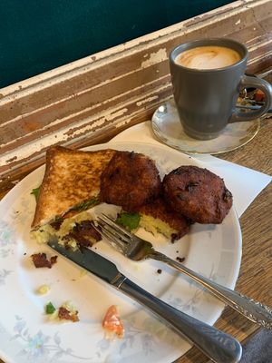 Half devoured vegan toastie and hash browns   at Samuel Pepys Cafe in Launceston