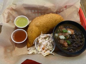 Vegan restaurant week special: giant empanada with vegan carnitas and beans rancheros   at Monse's Pupuseria in Colorado Springs