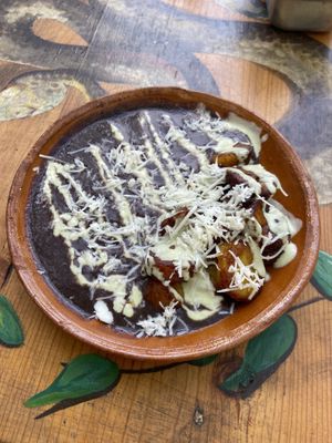 Fried plantain with black beans, tofu cream and vegan cheese   at Aguacate Limon in Tulum