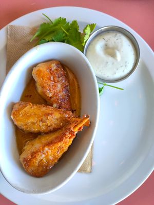 Wings with surprisingly delicious garlic sauce at The Burrow in Vancouver