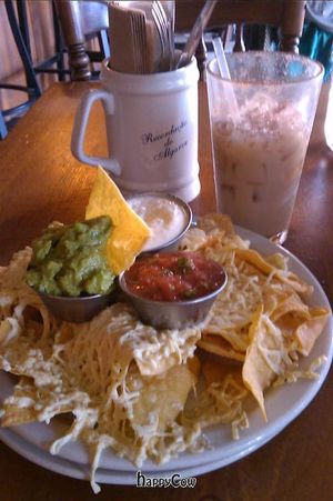 Vegan nachos with daiya mozzarella and homemade vegan sour cream, and a soy horchata drink at The Burrow in Vancouver