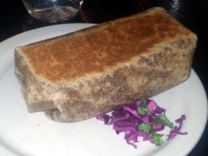 RONNY RUSSELL Roasted yams and onions, fresh guacamole, black beans, green salsa, purple cabbage & toasted pumpkin seeds. at The Burrow in Vancouver