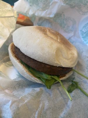 Vegan Sausage sourdough muffinn with a  at LEON in South West London