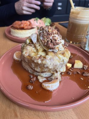 Vegan “Madame Julia” pancakes, with mashed banana, apple and mandarin, vegan whipped cream and nuts, and maple syrup at Madame Julia in Strasbourg