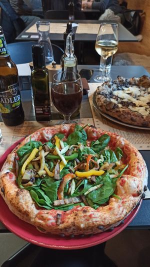 Vegetable pizza with vegan cheese at Peruzza in Ljubljana