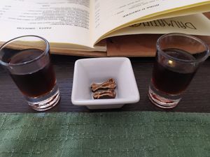 Carob liquor with its dried fruit as entree 🥃 at Dalmatino in Hvar