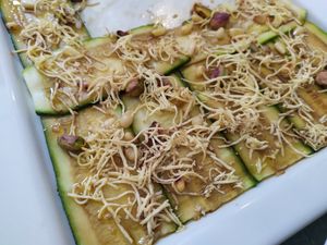 Zucchini carpaccio with peanuts, pistachios and smoked tofu 🥜 at Dalmatino in Hvar