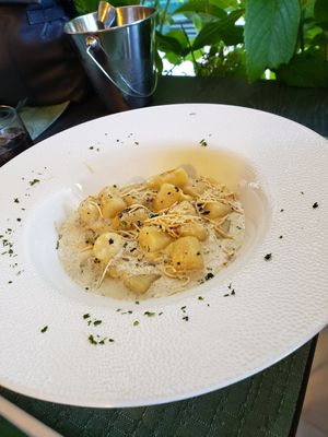 Gnocchi with creamy truffle sauce and smoked Tofu shavings. at Dalmatino in Hvar