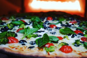Tomatoes, olives and basil  at Costa Pizza in New Haven