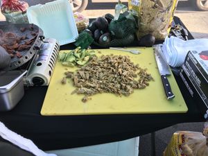 Al pastor “beef” wheat meat on the grill and chick’n on the cutting board ready to be loaded in to a torta or taco.  at California Vegan Food Company in San Jose
