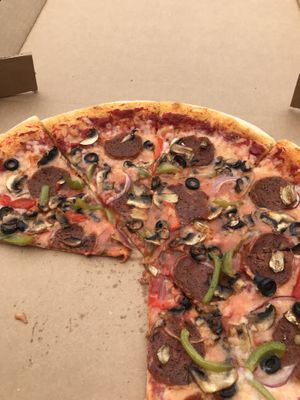 With supreme pizza  at Possum Pizza in Austin