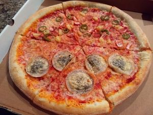 Half mushroom ravioli pizza & half Hawaiian at Possum Pizza in Austin