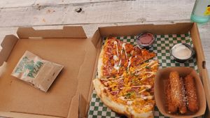 Bacon mac pizza, buff cali pizza, cheese sticks, and chocolate chip cookies! at Possum Pizza in Austin