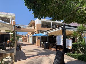From street level its on the first floor and their are steps around to the right hand side with the chair lift, and behind the restaurant near the spar at Wanderlust Garden in Mallorca