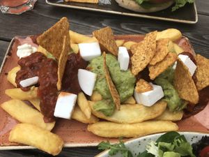 loaded fries with nachos, guacamole, salsa and vegan feta at Peter Pane in Lueneburg