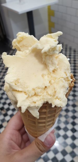 Pineapple and passion fruit ice cream on a cone (the cones are vegan too!) at Nutwood in Ericeira
