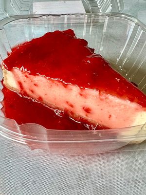 Vegan cheesecake with fruit topping 🍒   at Loving Hut in Cincinnati