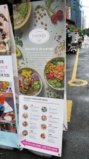 Sign outside with menu at Hooked Poke 훅트포케 in Seoul