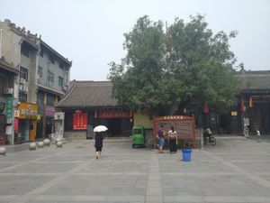The yellow cafe on the left at Sally's Dumplings - JM Kitchen in Xian