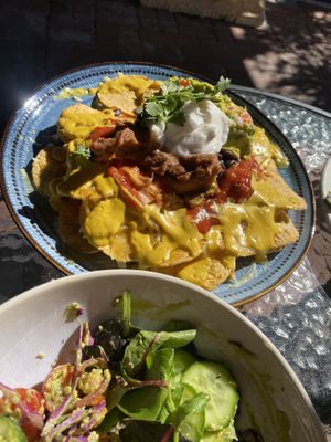Nachos loaded with beans, refried beans, melted cheese, cheese sauce, guacamole AND sour cream!  at Vegalicious in Ettalong Beach
