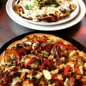 Vegan pizza and vegetarian nachos  at Basil Pizza in Newtown