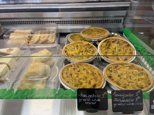 The carrot cake was good, but too sweet. The cheese/pesto roll (with a hint of blue cheese?), sausage roll (with mustard) and frikandelbroodje were delicious. The quiche was decent and not greasy, but too salty. at Van Die Vegans in Hilversum