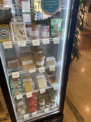 Fridge with vegan cheese and other savoury items at Van Die Vegans in Hilversum