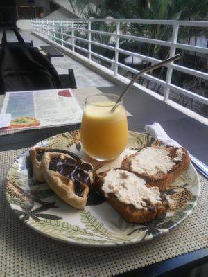 Combo de café da manhã. Torrada com humus, waffle de chocolate e suco de laranja. at Espaço VHMOR in Sao Paulo