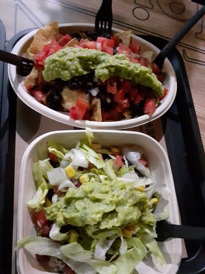Salad and nachos with guacamole and vegetables at Burritos - Ramon LLull in Valencia