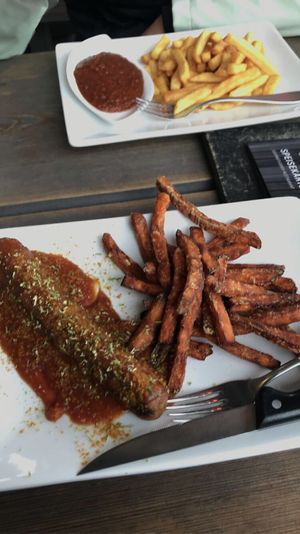 Vegan seitan currywurst with sweet potato fries  at De Lux Curry in Sylt