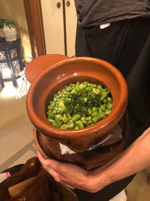 Rice with beans and parsley cooked in an earthenware pot at Chakura in Sakaishi