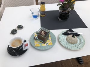 Oat mylk coffee, peanut butter & choc mousse and coconut cake. at Aurora Sweets in Korcula