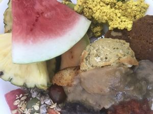 Biscuits and gravy, tofu scramble, potatoes and fruit from their Sunday buffet at Jyoti-Bihanga in San Diego