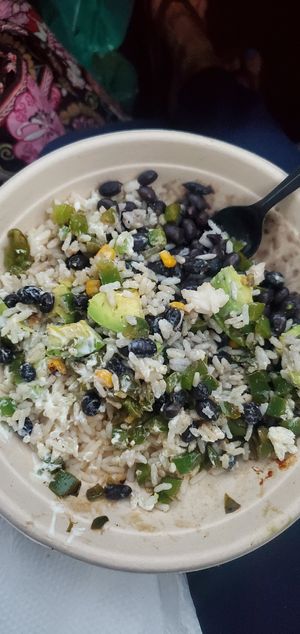 Veggie Taco bowl w/coconut rice without the cheese, it was good but very few veggies. Nothing too exciting but good for travelers that ate very little all day at Shaka Taco in Surf City