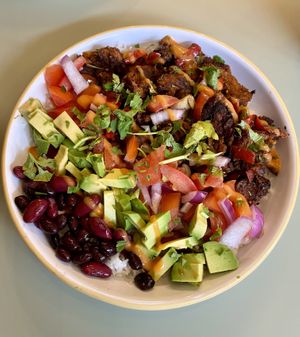Burrito rice bowl 💚🧡❤️🧡💛  at Monstera Canteen in Luton