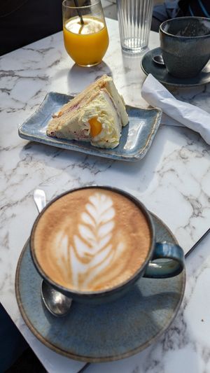 Peach Melba cake and an almond milk latte at The Find in Cheltenham
